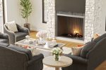Relax by the wood burning fireplace in the home`s great room.